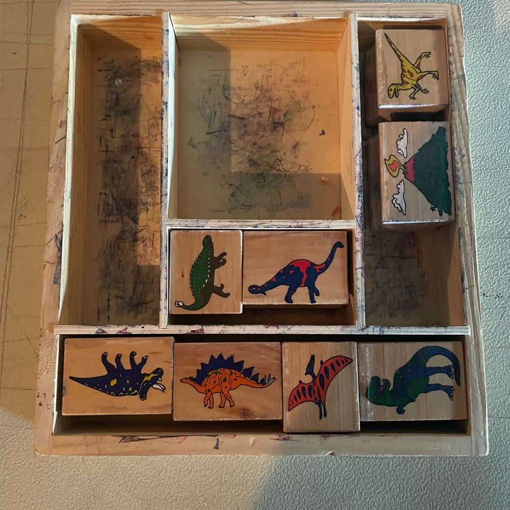 8 dinosaur stamps in wooden box
